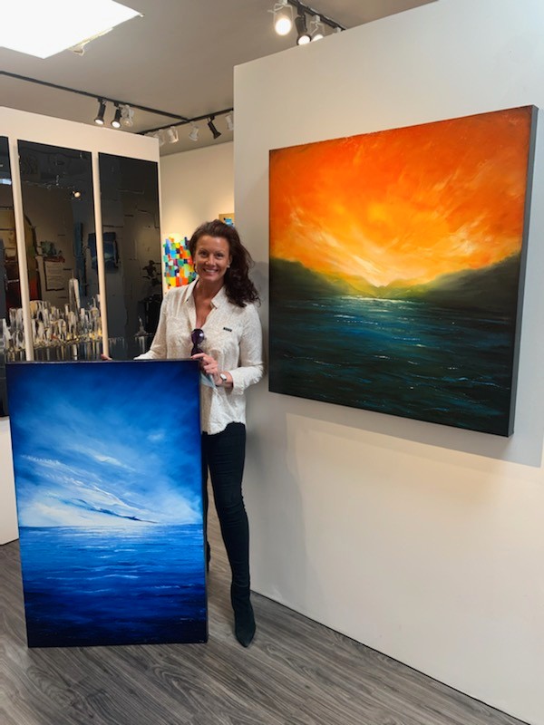 Jenny Simon delivering art to The Signature Gallery